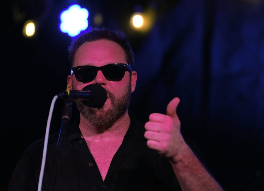 Closeup photo of singer giving thumbs up sign