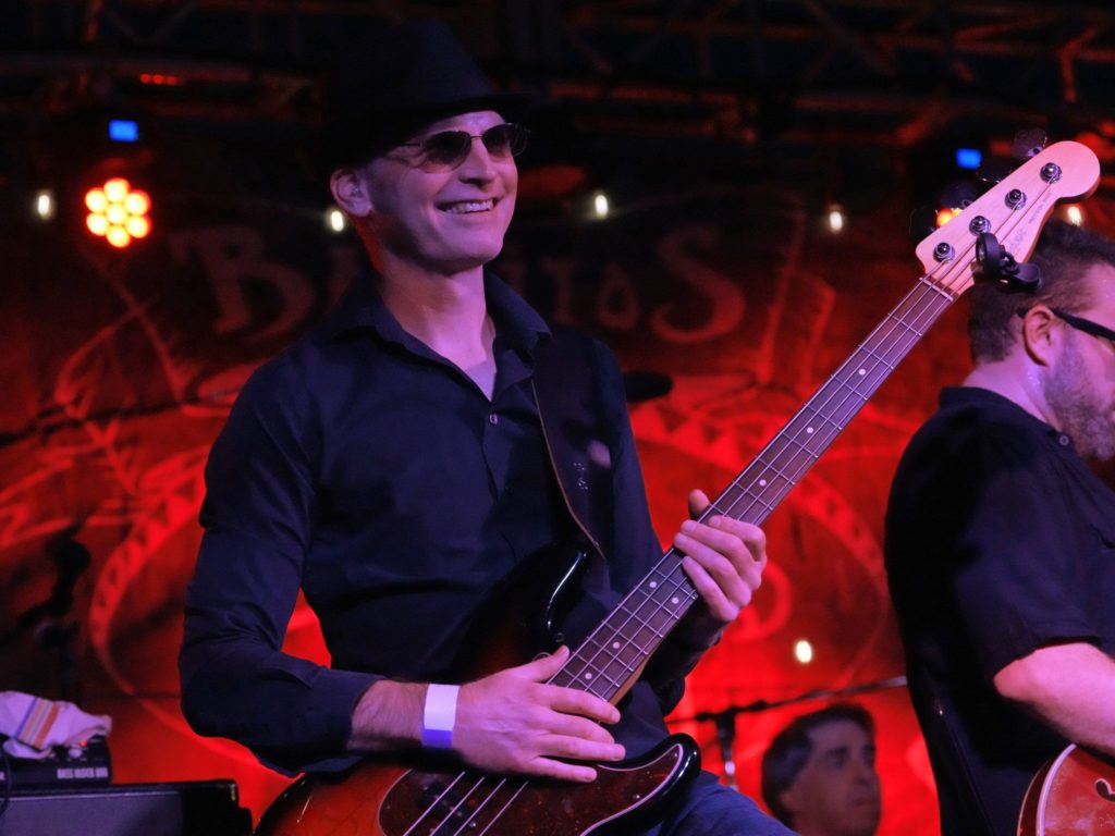 Bass player laughing and smiling